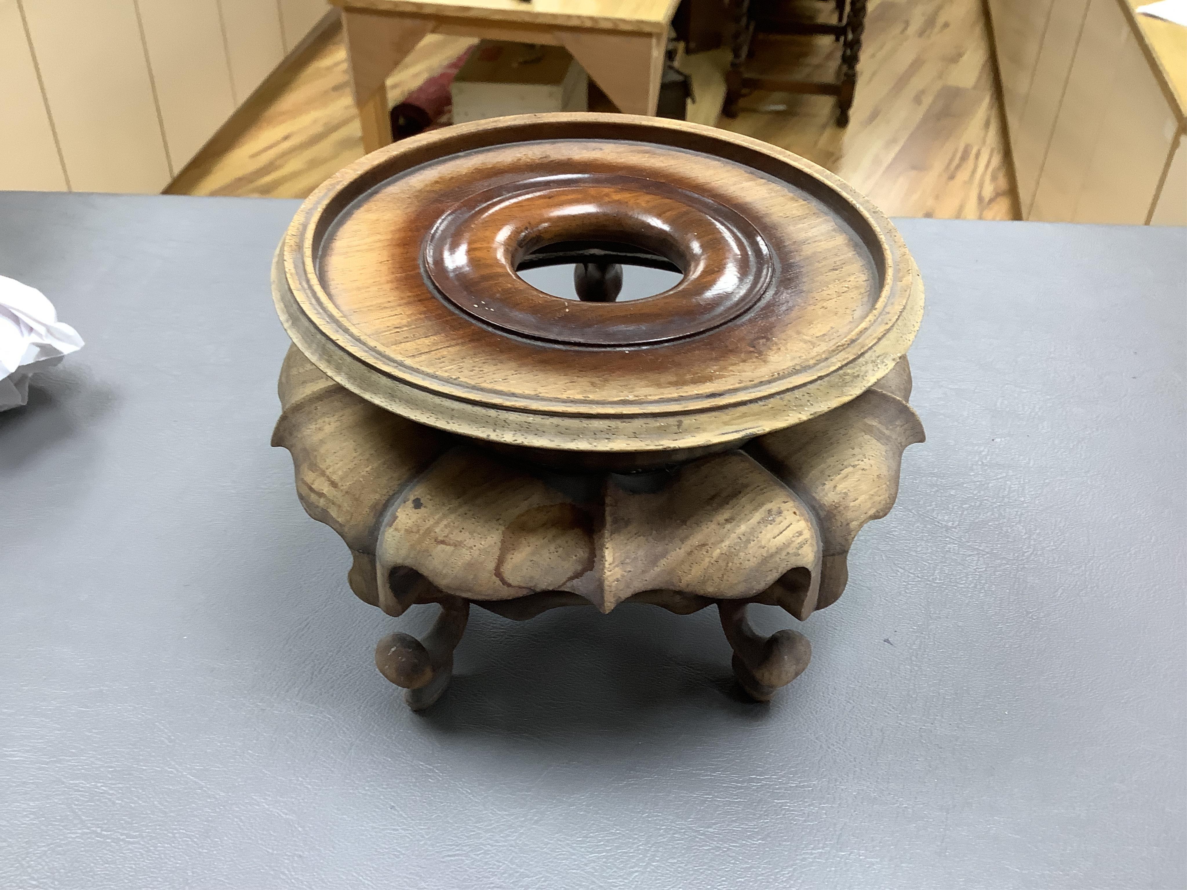 A Chinese famille verte enamelled prunus jar, 19th century, with wood cover and stand, 25cm high